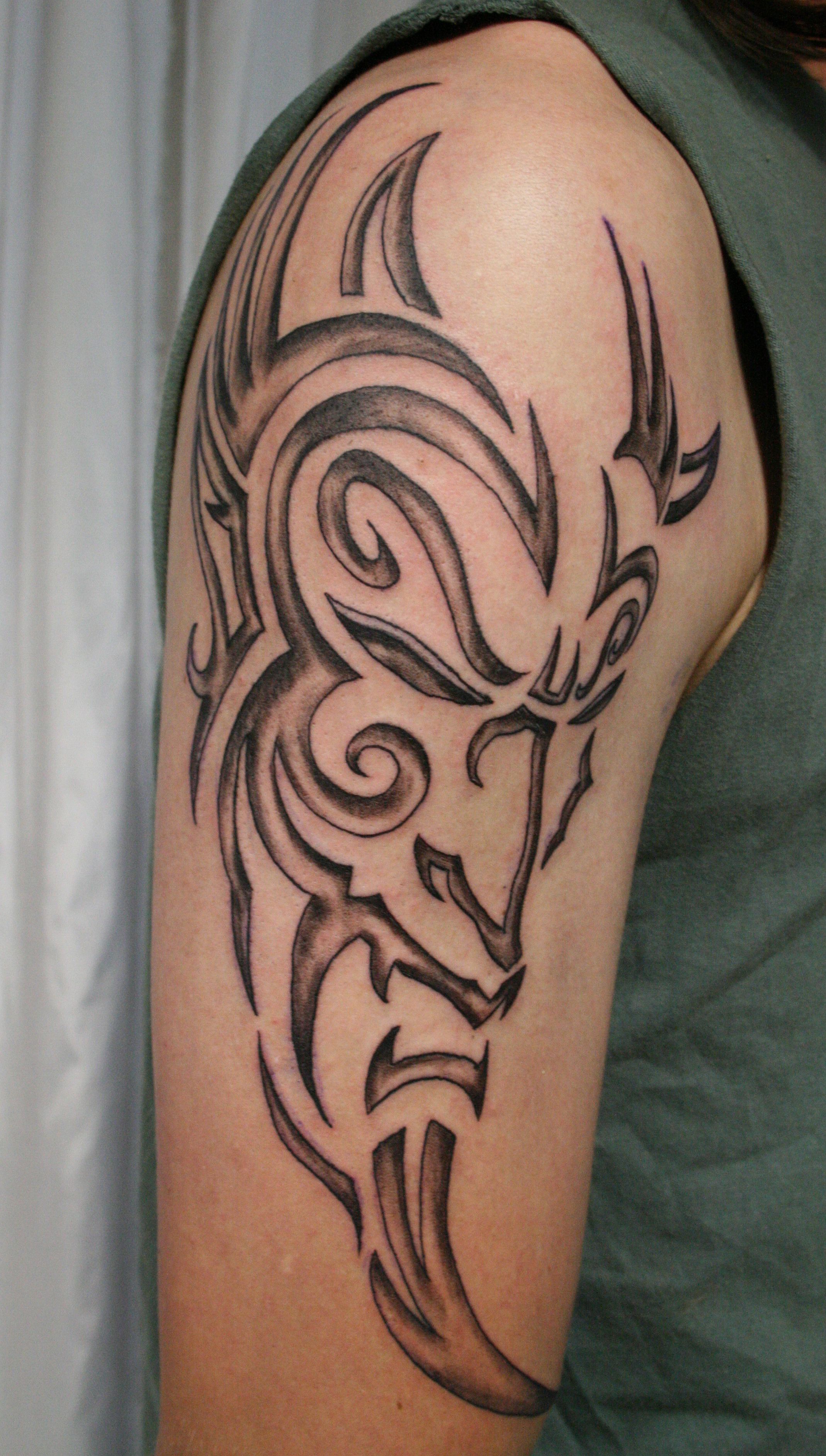 http://fc05.deviantart.net/fs29/f/2008/163/f/9/Tribal_Devil_Tattoo_by_2Face_Tattoo.jpg