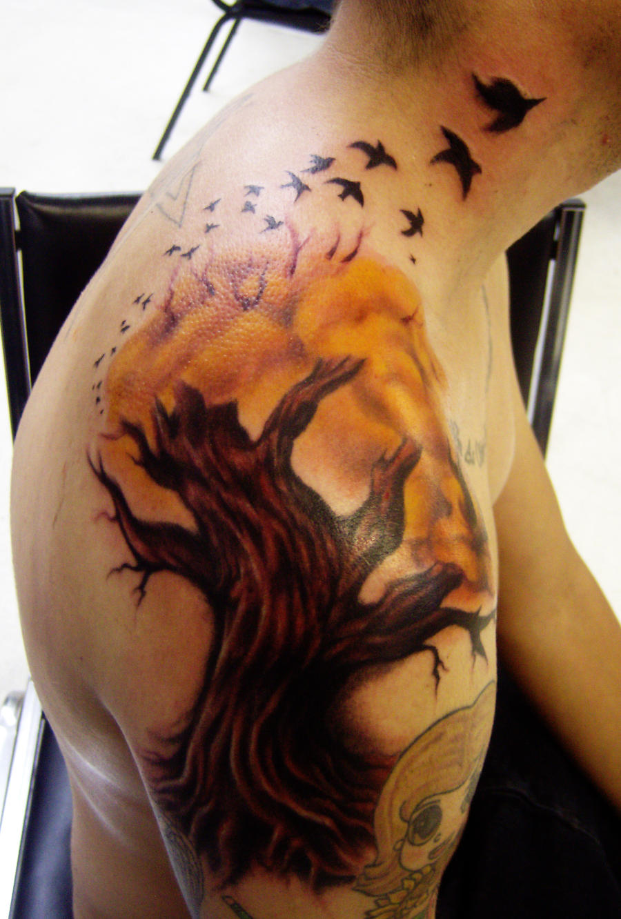 tree tattoo with birds by